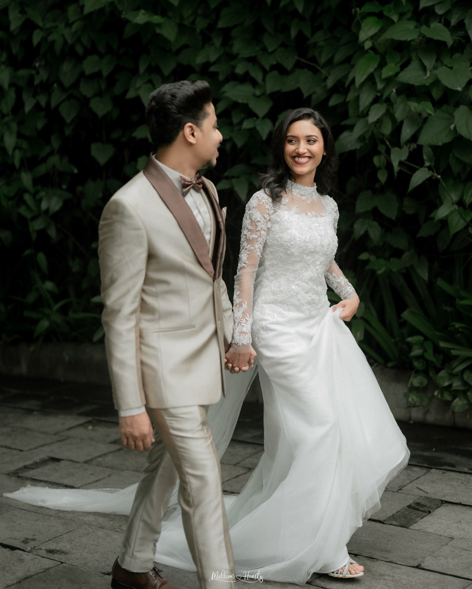 A newlywed couple looking into each other's eyes